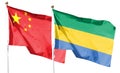 Flag of China and Republic of Gabon on cloudy sky. Royalty Free Stock Photo