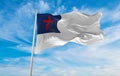 flag of Christian waving in wind at cloudy sky. love holy spirit faith, people hope in easter, religion concept. Copy space Royalty Free Stock Photo