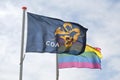 Flag of the COA and a rainbow flag in front of an AZC Royalty Free Stock Photo