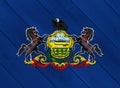 Flag and coat of arms of Commonwealth of Pennsylvania on a textured background. Concept collage