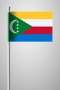 Flag of Comoros. National Flag on Flagpole. Isolated Illustration on Gray Royalty Free Stock Photo