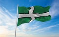 flag of county Devon , UK at cloudy sky background on sunset, panoramic view. County of united kingdom of great Britain, England. Royalty Free Stock Photo