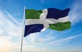 flag of county Oxfordshire modern version , UK at cloudy sky background on sunset, panoramic view. County of united kingdom of