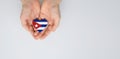 Flag of the Cuba in the shape of a heart in the hands. Royalty Free Stock Photo