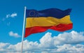 flag of Daco-Romance peoples Serbian Romanians at cloudy sky background, panoramic view. flag representing ethnic group or culture