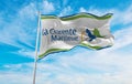 flag of department of Charente Maritime, France at cloudy sky background on sunset, panoramic view. French travel and patriot