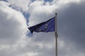 Flag of the European Union against the cloudy sky Royalty Free Stock Photo