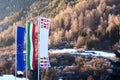The flag of European Union, Italy and other countries are developing against the backdrop of Dolomites in the spring Royalty Free Stock Photo