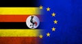 Flag of the European Union with Republic of Uganda National flag. Grunge background