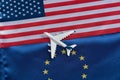 Flag of European Union and USA with toy airplane. Concept of flights from Europe to United States of America