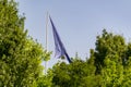 Flag of the European Union waving on a flagpole in a park in the city of Madrid, in Spain. Europe. Royalty Free Stock Photo