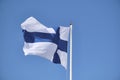 Flag of Finland on a white flagpole Royalty Free Stock Photo