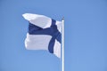 Flag of Finland on a white flagpole. Royalty Free Stock Photo