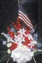 Flag and Flowers in front of Vietnam Wall Memorial, Washington, D.C. Royalty Free Stock Photo