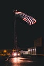 The flag flying under the truck