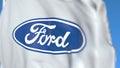 Flag with Ford Motor Company logo, close-up. Editorial 3D rendering