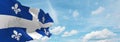 flag of French ancestry Quebecois people at cloudy sky background, panoramic view. flag representing extinct country,ethnic group