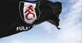 flag of Fulham Football Club waving in the wind on a clear day