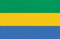 Flag of Gabon. Gabonese flag on fabric surface. Fabric Texture