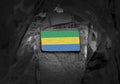 Flag of Gabon on soldiers arm. Gabonese Republic flag on military uniform. Army, troops, military, Africa collage Royalty Free Stock Photo