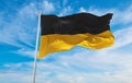 flag of Gera at cloudy sky background on sunset, panoramic view. Federal Republic of Germany. copy space for wide banner