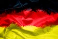 Flag of German Federal Republic of Germany by watercolor paint brush on canvas fabric, grunge style Royalty Free Stock Photo