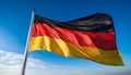 The flag of Germany on a pole blowing in the wind Royalty Free Stock Photo