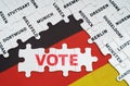 On the flag of Germany there are puzzles with the names of cities and puzzles with the inscription - Vote