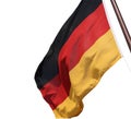 Flag of Germany waving in the wind on the wooden flagpole. German national flag made of silky fabric Royalty Free Stock Photo