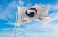 flag of Government of the Republic of Korea , South Korea at cloudy sky background on sunset, panoramic view. Korean travel and