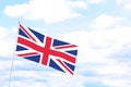 Flag of Great Britain on cloudy day, space for text. Learning English Royalty Free Stock Photo