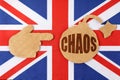 On the flag of Great Britain there is a bomb cut out of cardboard and a sign with the inscription - chaos