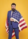 The flag is his pride. Bearded man holding american flag on independence day. Patriotic businessman celebrating flag day