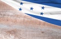 Flag Honduras and space for text on a wooden background