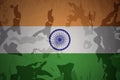 flag of india on the khaki texture . military concept