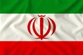 Flag of Iran on a gentle silk with folds in the wind