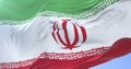 Irani flag waving at wind in slow in blue sky, loop