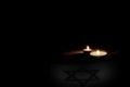 Flag of Israel, burning candles . Holocaust Memorial Day Royalty Free Stock Photo