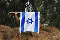 Flag of Israel in the hand of an Israeli soldier. Concept: Soldiers Tzahal Israel Defense Forces,  IsraelI soldiers Royalty Free Stock Photo