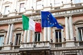 Flag of Italy and United Europe on government in Rome