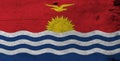 Flag of Kiribati on wooden plate background. Grunge Kiribati flag texture.