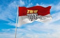flag of Koln at cloudy sky background on sunset, panoramic view. Federal Republic of Germany. copy space for wide banner