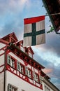 Flag of Konstanz against half-timbered historical house in the center of Konstanz City, Baden-Wurttemberg, Germany