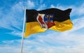 flag of Krefeld at cloudy sky background on sunset, panoramic view. Federal Republic of Germany. copy space for wide banner