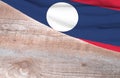 Flag Laos and space for text on a wooden background