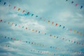 flag line with cloudy sky .