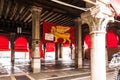 The flag with the lion of St. Mark is hanging in the market hall of the Rialto Market in Venice. The famous market offers daily fr