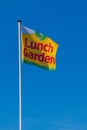 Flag with logo of the self-service company Lunch Garden on a restaurant in Brussels in Belgium