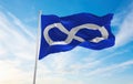 flag of Metis Blue , Canada at cloudy sky background on sunset, panoramic view. Canadian travel and patriot concept. copy space