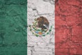 Flag of Mexican on stone wall, grunge background. Flag of Mexican depicted in bright paint colors